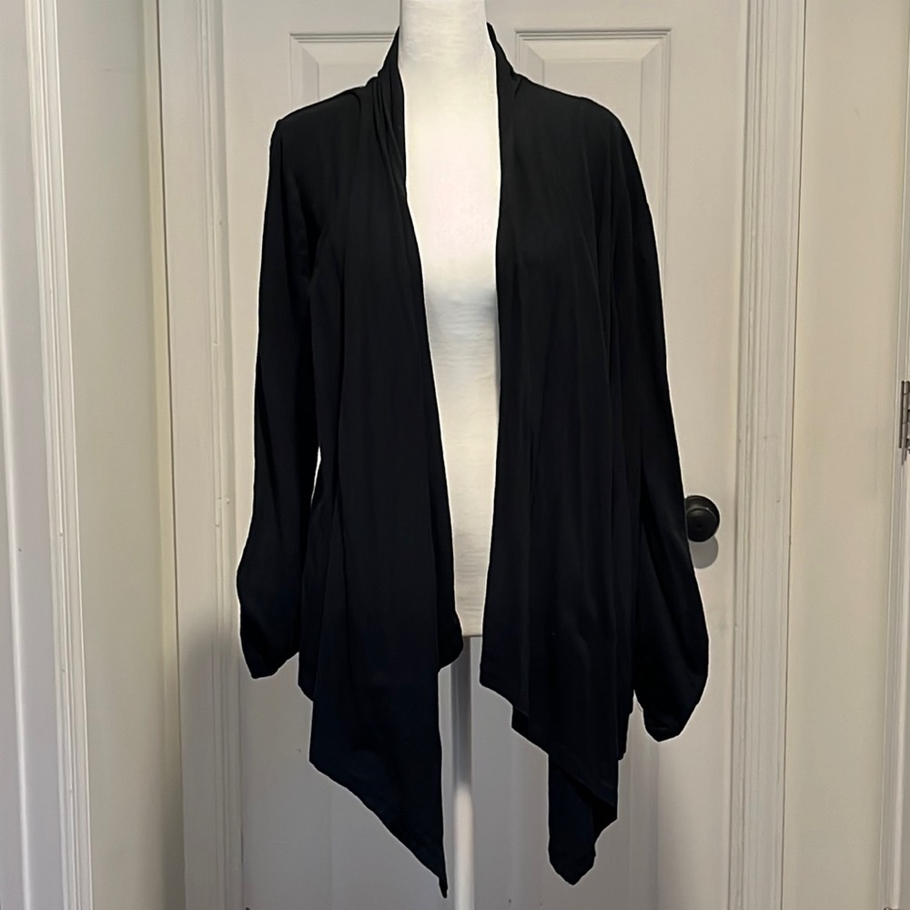 Gently worn black cardigan with adjustable sleeves. Size large.